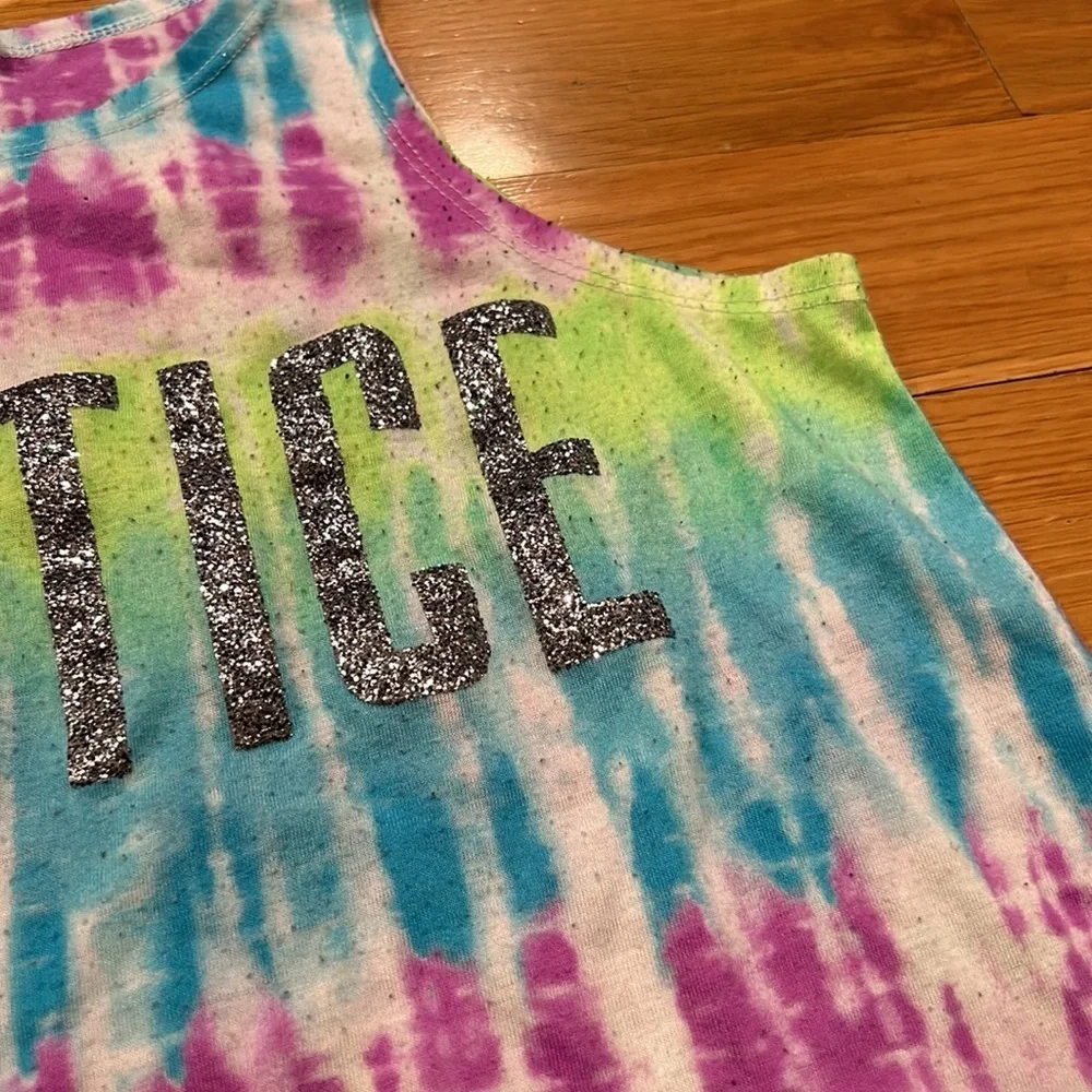 Justice size 10 girl tank top- pulling due to wash